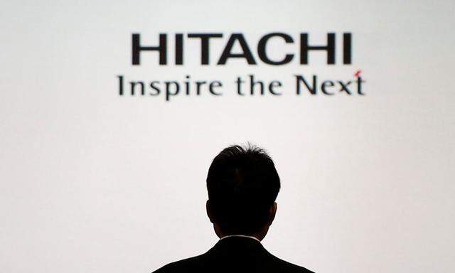 FILE PHOTO: A logo of Hitachi Ltd is seen at a news conference in Tokyo