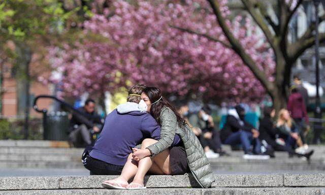 April 11, 2020, New York, New York, United States: Couple is vito with protective mask in Union Square in Manhattan in N