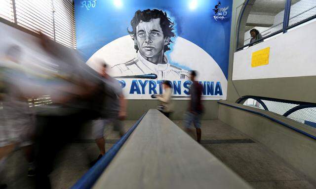 Brazilians arrive at the Ayrton Senna school to cast their votes in the presidential election, in Rio de Janeiro