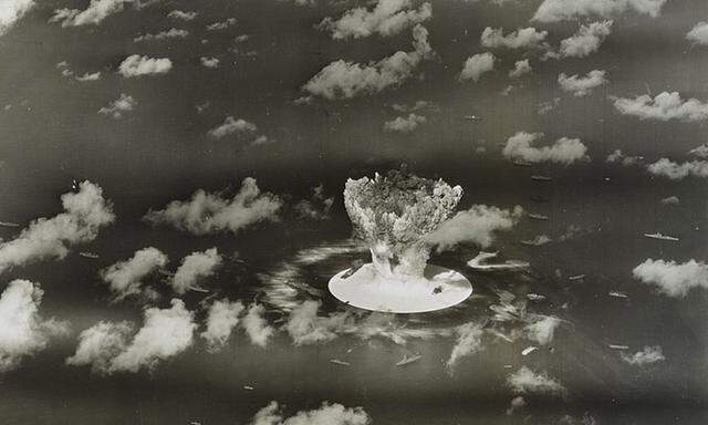 File handout picture of a mushroom cloud rising with ships below during Operation Crossroads nuclear weapons test on Bikini Atoll, Marshall Islands