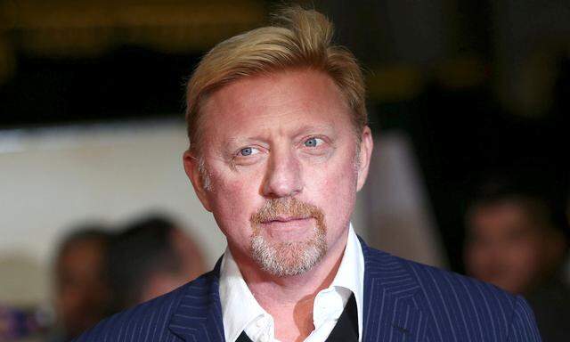 FILE PHOTO: Former tennis player Boris Becker poses for photographers at the world premiere of the film 'I am Bolt' in London