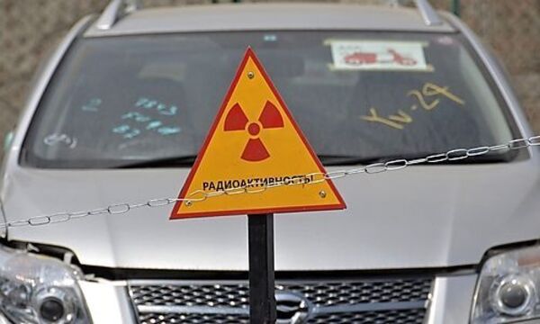 A car delivered from Japan is seen behind a sign at the port of Russias far eastern city of Vladivoss far eastern city of Vladivos