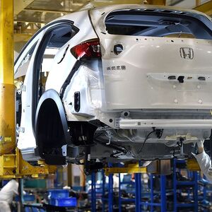 Worker wearing a face mask is seen on a production line at the plant of Dongfeng Honda Automobile Co in Wuhan
