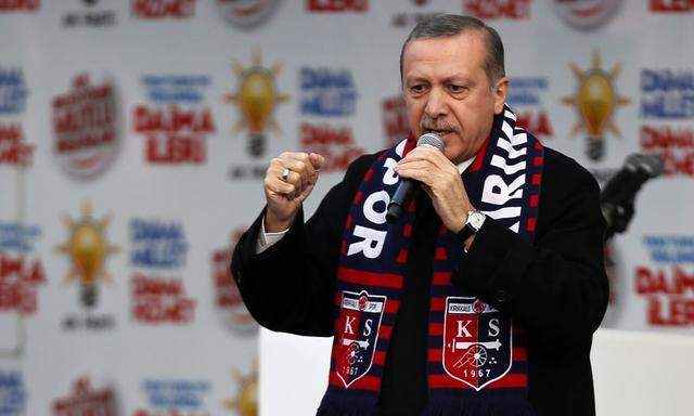 Turkey's Prime Minister Tayyip Erdogan addresses the crowd during an election rally in Kirikkale