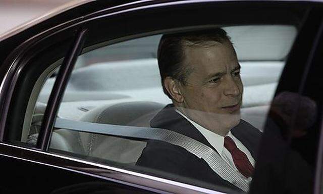 U.S. Special Representative for North Korea Glyn Davies sits in a car as he leaves a hotel in Beijing