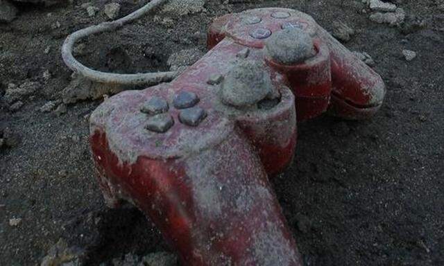 A Sony playstation controller is seen at an area that was devastated by last weeks earthquake and tss earthquake and ts