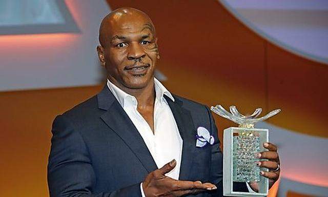 Former professional boxer Mike Tyson poses after receiving the 'Sportel Special Prize Autobiography' award at Sportel in Monte Carlo