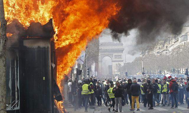 Burning newsagent's is seen during a demonstration by the 'yellow vests' in Paris