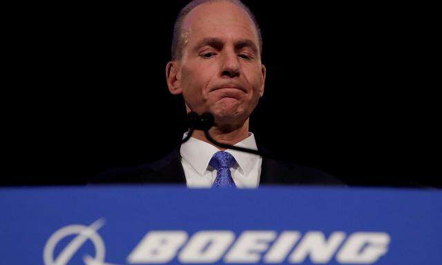 FILE PHOTO: Boeing CEO Muilenburg pauses while speaking during a news conference at the annual shareholder meeting in Chicago