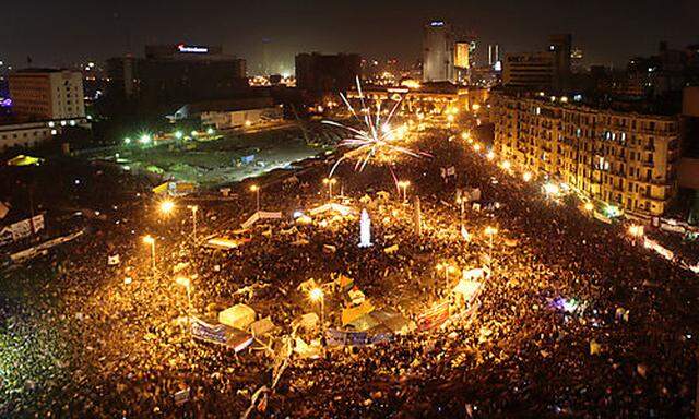 Fireworks explode over Tahrir Square to mark the first anniversary of the popular uprising that unsea