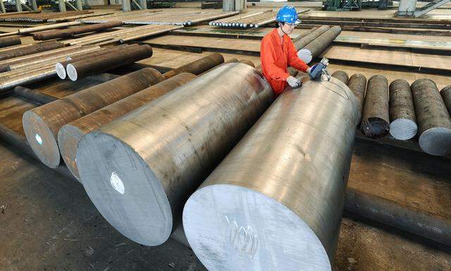 An employee works at a steel factory in Dalian