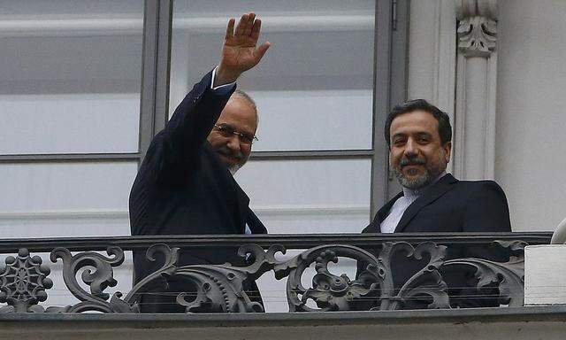 Iranian Foreign Minister Zarif and Araghchi, Iran's chief nuclear negotiator, stand on the balcony of Palais Coburg in Vienna