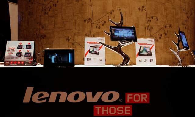 FILE PHOTO: Lenovo tablets and mobile phones are displayed during a news conference on the company's annual results in Hong Kong