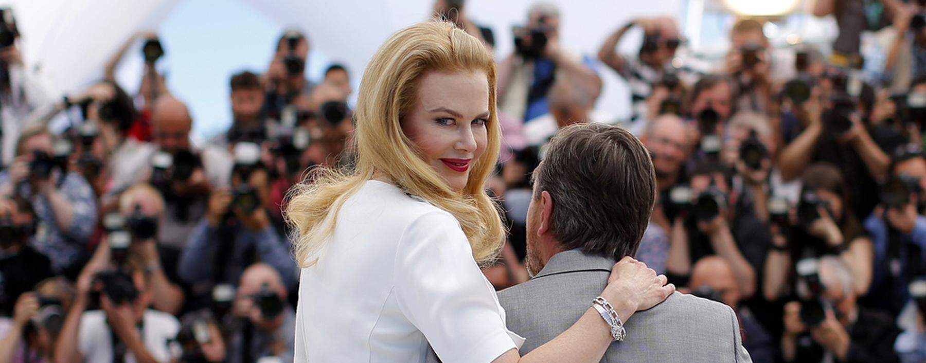 Cast members Nicole Kidman and Tim Roth pose during a photocall for the film ´Grace of Monaco´ out of competition before the opening of the 67th Cannes Film Festival in Cannes