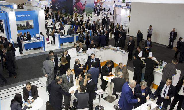 Attendees talk at Greece´s stand at the International Tourism Trade Fair (ITB) in Berlin