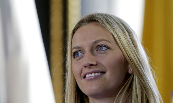 FILE PHOTO: Czech Republic's Petra Kvitova smiles during the draw for the Fed Cup final in Prague