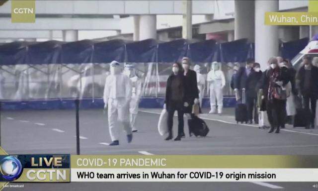 Still image of WHO team tasked with investigating the origins of the coronavirus disease (COVID-19) pandemic arriving at Wuhan Tianhe International Airport