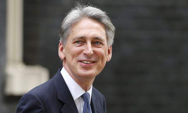 Britain´s new Foreign Secretary Philip Hammond arrives at 10 Downing Street in central London