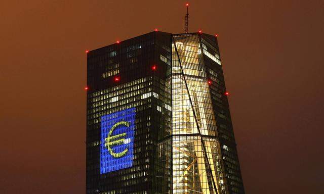 Headquarters of the European Central Bank (ECB) is seen illuminated with a giant euro sign at the start of the ´Luminale, light and building´ event in Frankfurt