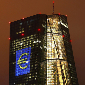 Headquarters of the European Central Bank (ECB) is seen illuminated with a giant euro sign at the start of the ´Luminale, light and building´ event in Frankfurt