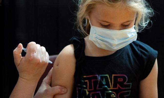 Children age 5-11 receive vaccination against coronavirus disease (COVID-19) in Collegeville