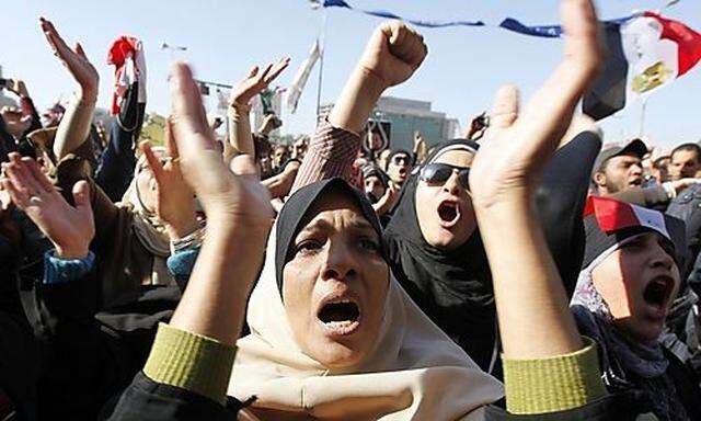 Protesters shout anti-military council slogans at Tahrir Square in Cairo