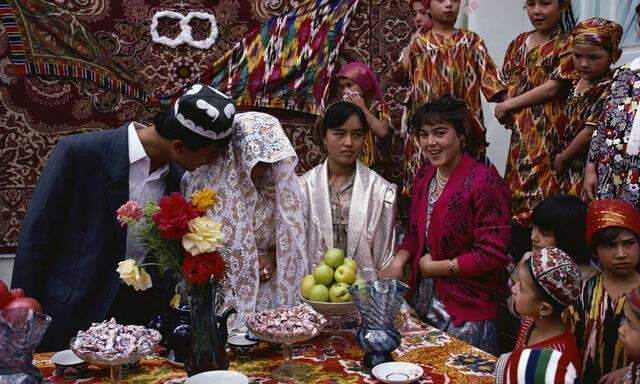 Bride and groom and other guests at a wedding in a village at Yorilgan in Uzbekistan Central Asia