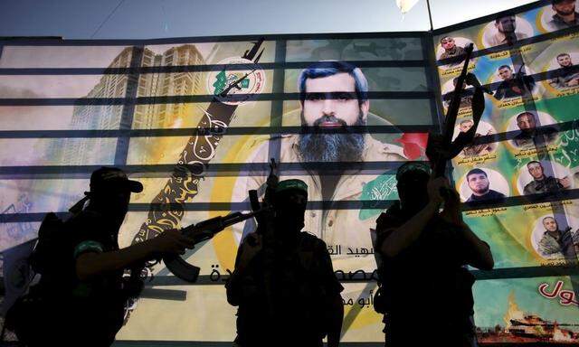 Palestinian Hamas militants take part in an anti-Israel military parade in Beit Hanoun town in the northern Gaza Strip 