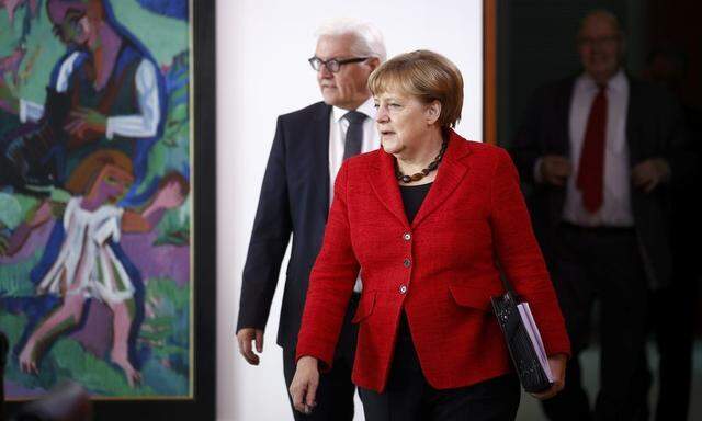 German Chancellor Merkel and FM Steinmeier arrive for the weekly cabinet meeting at the Chancellery in Berlin