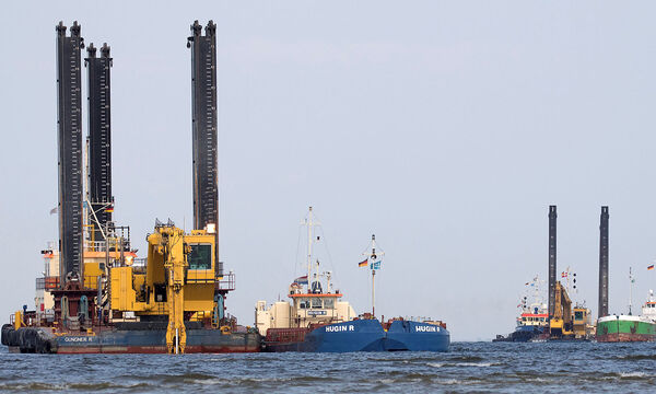 FILE PHOTO: Floating excavators prepare an underwater trench for the North Stream 2 pipeline close to Lubmin