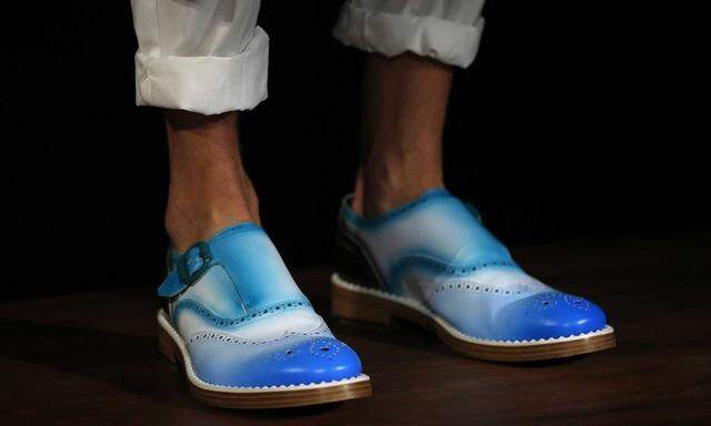 File photo of a model presentuing a creation from Jimmy Choo during its 'London Collections: Men' show in London