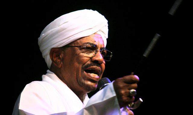 Sudan´s President Omar Hassan al-Bashir speaks to the crowd after a swearing-in ceremony at green square in Khartoum