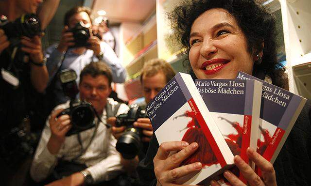 Berkewicz head of publishers Suhrkamp holds books by author Vargas Llosa after he was announced as Noble Prize winner in Frankfurt