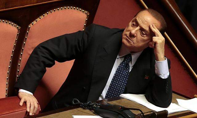 Italian center-right leader Berlusconi looks on at the Senate in Rome