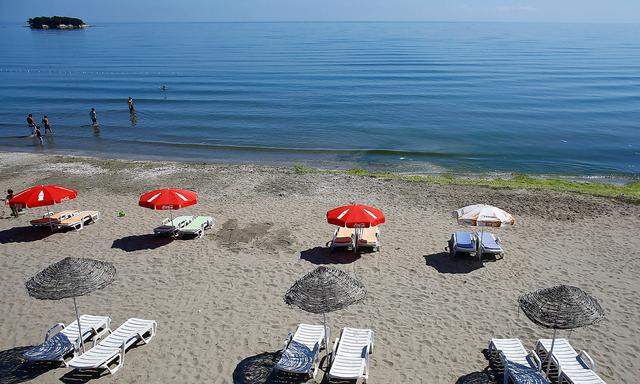 People enjoy the beach, iin the Black Sea coast city of Sinop, Turkey