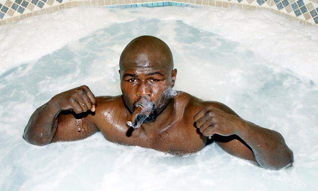 Boxer James Toney poses in a Jacuzzi at the Foxwood Casino resort in Mashantucket, Connecticut the m..