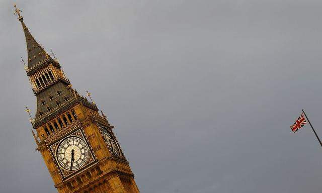 An Union flag is seen fluttering next to the Big Ben in London