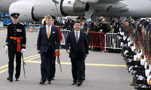 Xinhua Chinese President Xi Jinping R reviews an honour