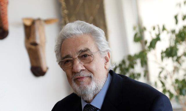 FILE PHOTO: Opera singer Placido Domingo sits during an event at the Manhattan School of Music in New York