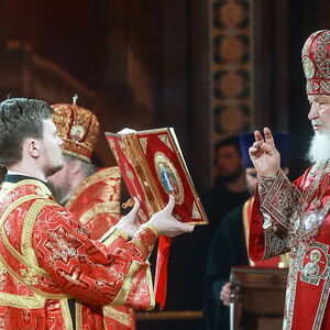 MOSCOW, RUSSIA - APRIL 24, 2022: Patriarch Kirill (R) of Moscow and All Russia holds an Easter service at the Cathedral