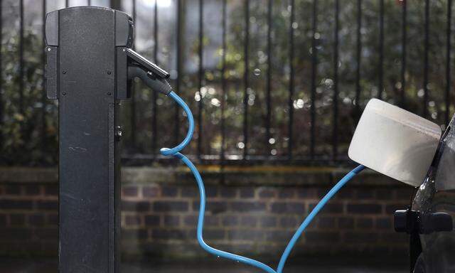 A car is plugged in at a charging point for electric vehicles in London