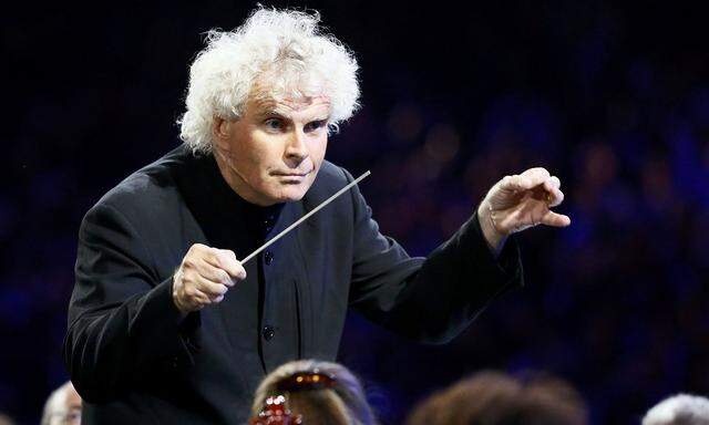 Conductor Simon Rattle takes part in the opening ceremony of the London 2012 Olympic Games at the Olympic Stadium