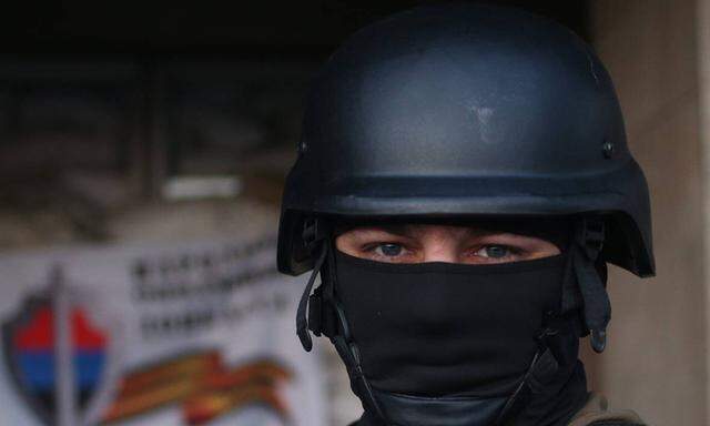 ITAR TASS DONETSK REGION UKRAINE APRIL 18 2014 A member of Donbass defence units on guard at th