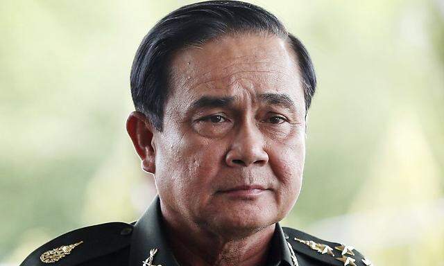 Thai Army chief General Prayuth Chan-ocha arrives to give a news conference at the Army Club in Bangkok