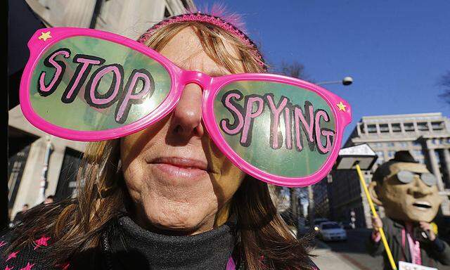 Founder of Code Pink protests against U.S. President Barack Obama and the NSA before arrival at Department of Justice in Washington