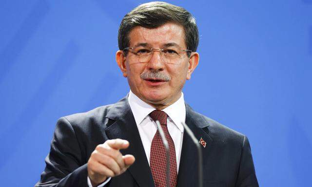 Turkish Prime Minister Davutoglu speaks to media after his meeting with German Chancellor Merkel at the Chancellery in Berlin