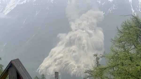 Sludge and rock slide down a mountain after the glacier has collapsed.