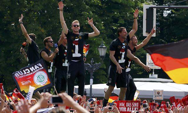 Members of Germany´s 2014 Brazil World Cup appear on stage celebrations at ´fan mile´ in Berlin