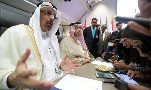 Saudi Arabia's Oil Minister al-Falih talks to journalists at the beginning of an OPEC meeting in Vienna