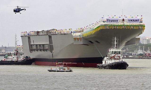 India's Indigenous Aircraft Carrier P-71 'Vikrant', built for the Indian Navy, leaves Cochin Shipyard after its launch in the southern Indian city of Kochi